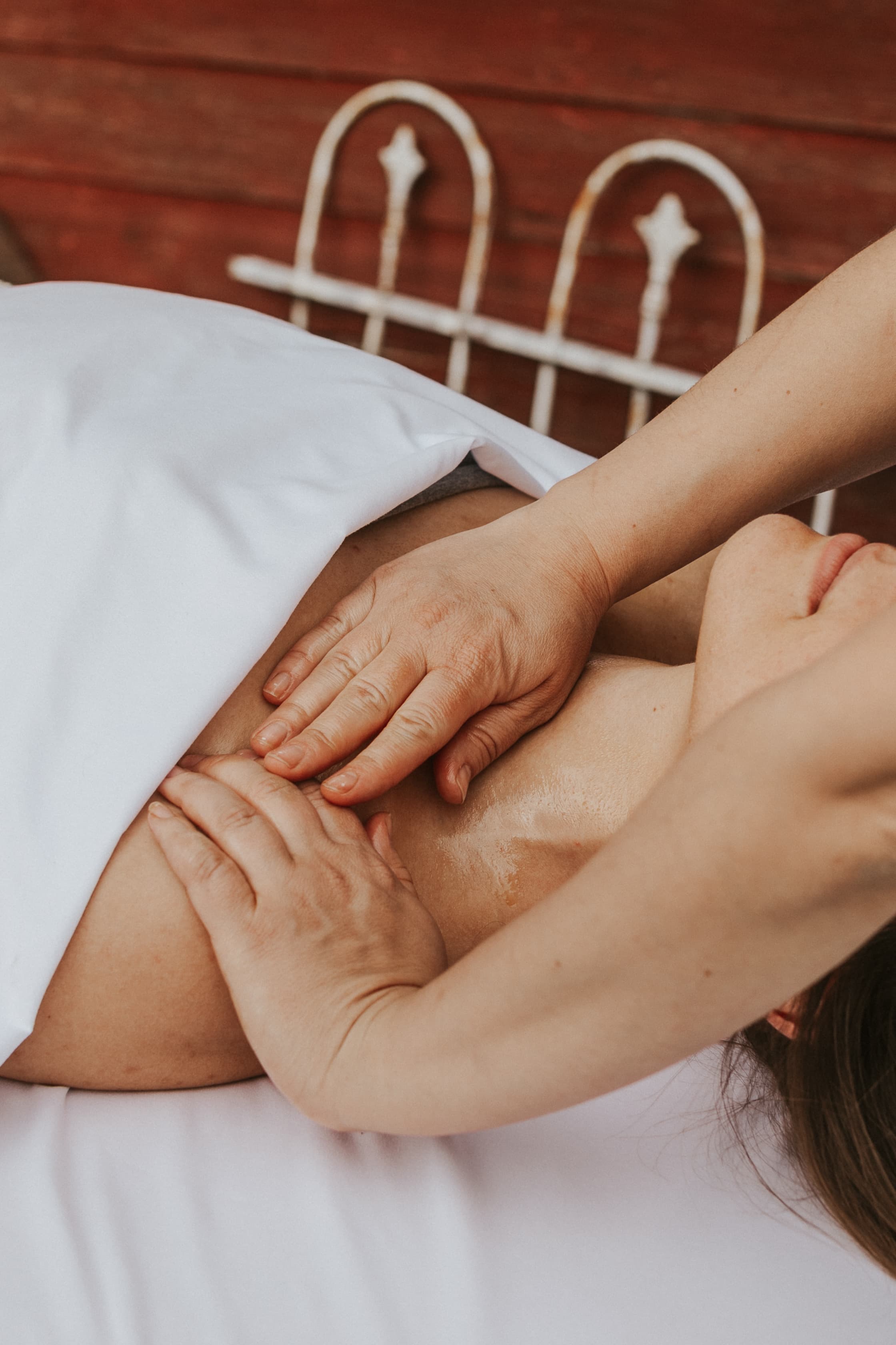 Woman receiving facial massage as part of treatment